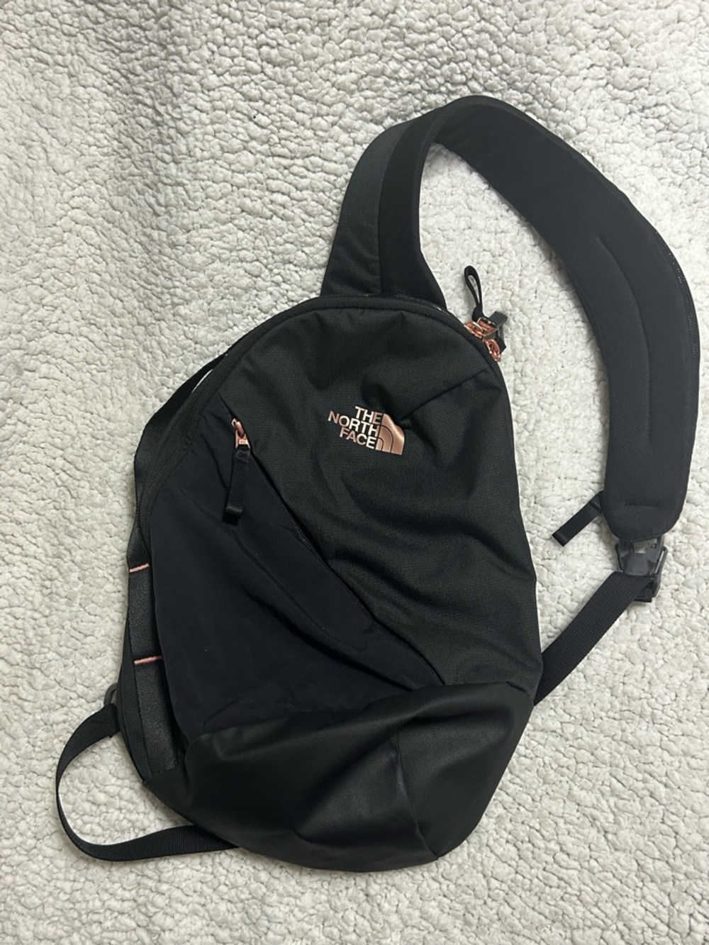The North Face Black Sling Pack with Rose Gold Logo